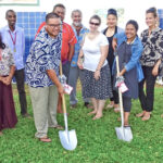 Majuro Coop School Board President Ben Wakefield and UNDP's Limbok Sawej took up shovels as part of the groundbreaking for the school’s new solar power and water project supported by UNDP. Photo: Giff Johnson.