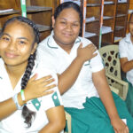 MIHS students, from left, Lynn Anien, Katrina Amram, and Crystal Amram were among 469 students receiving their initial Covid vaccine on October 15. Photo: Willmer Joel.