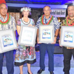 Holding framed giant postage stamps marking the 35th Compact anniversary are, from left, RMI Postmaster Dexter Jikit, Finance Minister Brenson Wase, Ambassador Roxanne Cabral, President David Kabua, Foreign Minister Casten Nemra, and Postal Authority Board Chairman Junior Aini. Photo: Wilmer Joel.