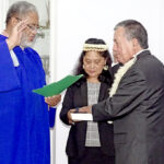 At a ceremony November 3 at the Cabinet conference room in Majuro, High Court Chief Justice Carl Ingram, left, swore in new Cabinet Minister John Silk as Silk’s wife Mary held the Bible. Photo: Eve Burns.