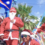Pan Pacific Foods laid on a team of Santas for the annual Christmas parade in Majuro last Saturday. PPF employees Dolly, holding elf CK, Jhong, Heltha and Gemma were geared up for the holiday spirit. Photo: Wilmer Joel.