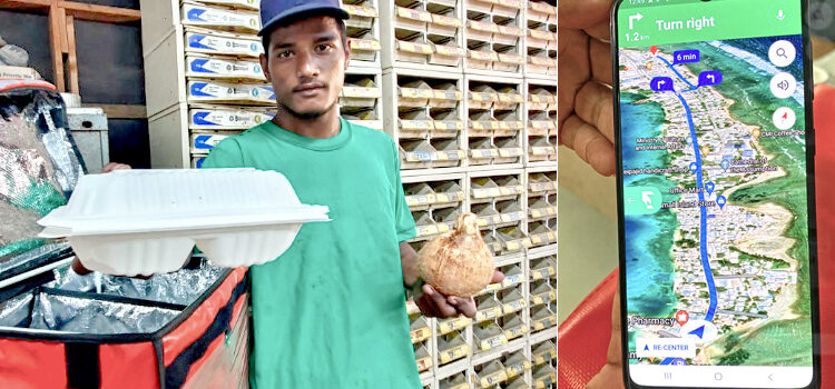 Wiahut delivery man Carlon Reiher delivers a lunch to customers at the Majuro Net Yard recently. Meals and more on wheels