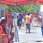 In Kiribati, government workers and volunteers carry Covid prevention and other supplies in this photo taken in Tarawa last week.