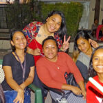 The smiles tell the story of the New Year’s Eve Block Party in Uliga: It was a blast. Photo: Wilmer Joel.