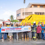 President David Kabua and Taiwan Ambassador Jeffrey Hsiao, center, joined with Majuro Mayor Ladie Jack, Majuro Nitijela Members, MALGov council people, MALGov workers, Taiwan Embassy representatives for the handover of the fire truck and them garbage truck. Photo: Hansen Kaisha.