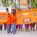 In this Journal file photo from the 50th anniversary of the Bravo hydrogen bomb test in 2004, Ejit Elementary School students march in the Nuclear Victims Remembrance Day parade.