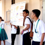 Marshall Islands High School student Silass Andrike leads her team in a presentation on campus during Education Week in mid-February. Photo: Wilmer Joel.