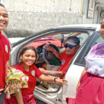 Taxi driver George Raymond with Rita Christian School students (from left) Stanley Johnson (sophomore), Abigail Lanwe (senior) and Wilma Hilai (Junior) posed for the Journal near the Micronitor office. George said the high price of fuel is making it increasingly difficult for him to make his $35 per day turn in to the taxi owner. Photo: Hilary Hosia.