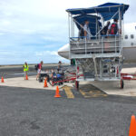 This file photo of a familiar scene of passengers boarding a United Airlines flight at Amata Kabua International Airport has not been seen since mid-January, when United suspended in and out-bound passengers from Majuro due to unsafe conditions in the airport terminal. This could change as early as April 11 now that the terminal renovation is completed. Photo: Giff Johnson.