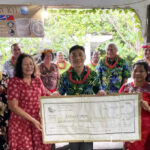Kora Fund officials and Kwajalein leaders with Taiwan Embassy Deputy Chief of Mission Mars Wang hand over the first check to Ebeye Kora Fund receipient Leilani Kemem.