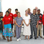US Ambassador Roxanne Cabral (white dress), Marshall Islands Red Cross Society Secretary General Ainrik George (next to Cabral), US Embassy officials, Red Cross staff and volunteers, Majuro hospital staff and CMI students at last week’s blood drive at the College of the Marshall Islands. Photo: Eve Burns.