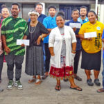 MALGov Sports Coordinator Chris Makphie, center back, joined with MALGov council members and team representatives to handover the prizes for the boys and girls teams that competed in the summer league. Photo: Hilary Hosia.
