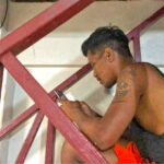 One of many Third Island residents who was quick to get online when CMI’s Distance Learning Center opened internet service to the community last week. Photo: Arthur Johnny.