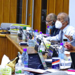 During a recent session of Nitijela, Finance Minister Brenson Wase, left, and Ailuk Nitijela Member Maynard Alfred, right, center, chat during a break. Ujae Nitijela Member Atbi Riklon, top right, and Majuro Nitijela Member Kalani Kaneko review documents. Photo: Hilary Hosia.