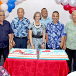As First Lady Ginger Kabua, foreground, enjoys the moment, leaders line up to cut the cakes. From left: Minister Wilbur Heine, Council of Irooj Chair Jimata Kabua, President David Kabua, Ambassador Roxanne Cabral, Interior’s Fred Nysta, Speaker Kenneth Kedi, Works Minister Jiba Kabua, and NRC Minister John Silk. Photo: Wilmer Joel.