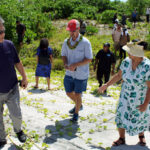 US Special Envoy for Compact negotiations Joseph Yun, left, and Foreign Minister Kitlang Kabua, right, make their way up the slope of the Runit Dome during a visit to Enewetak November 4 as members of the US and Marshall Islands Compact teams follow. Photo: Wilmer Joel