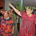 Miram deBrum and Lamjok Alik lift up the spirt during a Majuro Mejen Armej dance performance at Marshall Islands Resort Monday night to welcome the start of the WUTMI 21st Conference. Photo: Hilary Hosia