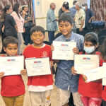 Majuro Cooperative School scholarship recipients show off their certificates and checks after the ceremony at the Marshall Islands Resort. Photo: Hilary Hosia.