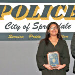 Michelle Nashion was awarded the Dispatcher of the Year and commendation, and also received a commendation and Life Saving Award for response to a shooting at Parsons Stadium. Presenting the awards was Springdale, Arkansas Police Chief Frank Gamble. Photo: Springdale Police Department.