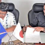 ICA Resident Representative Hikoyuki Ukai and RMI Environmental Protection Authority General Manager Moriana Phillip ink the agreement setting in motion the regional solid waste management program known as J-PRISM3.