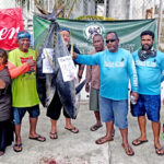Team Lajabonean team weighs in its two hefty yellowfin tuna at Ebeye Dock last Saturday as part of Marshall Islands Development Bank’s 35th anniversary celebration. Photo: Hilary Hosia.