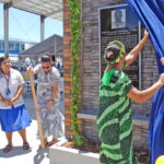 This fine memorial to SSG Solomon Sam, the only Marshall Islander to die in the Iraq war, was unveiled at the CMI Foundation Day opening Monday. At right are Sam’s older sister Freeda Sam Barai and Master Sgt. John Phillips. At left: Sam’s cousin Jakio Lanwe and niece Taylor Barai, and CMI’s Kelly Schellhase. Photo: Hilary Hosia.