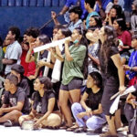 The Assumption High School team had a loud and faithful cheering section that helped keep its spirits high during the Constitution Day high school basketball championship game with Laura High School. Photo: Hilary Hosia.