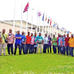 Presidents of each of the UCC youth chapters with their respective flags in front of the UCC mother church in Uliga Wednesday this week. Photo: Hilary Hosia.