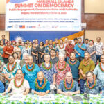 Marshall Islands President David Kabua, seated center, was joined at the opening of the Summit on Democracy by, from left: Ambassador Neijon Edwards, Rev. Jeledrik Binejal, Speaker Kenneth Kedi, keynote speaker Andy Winer, lead workshop trainer Floyd K. Takeuchi, and Pacific Media Institute co-founder Giff Johnson. At back are elected leaders and media workshop participants. Photo: Chewy Lin.