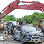 RMI police and quarantine officers dumped 900 pounds of confiscated betel nuts into the Majuro dump Tuesday this week. Photo: Hilary Hosia.