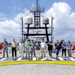 Crew members, Australian Embassy representatives and local residents on board the Australian naval vessel Reliant in Port Majuro. Photo: Hilary Hosia.