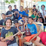 Announce a ukulele training program and what do you get? A lot of enthusiastic young people strumming ukuleles at the Sports and Extracurricular Program in Majuro. Photo: Xhania Zedkaia.