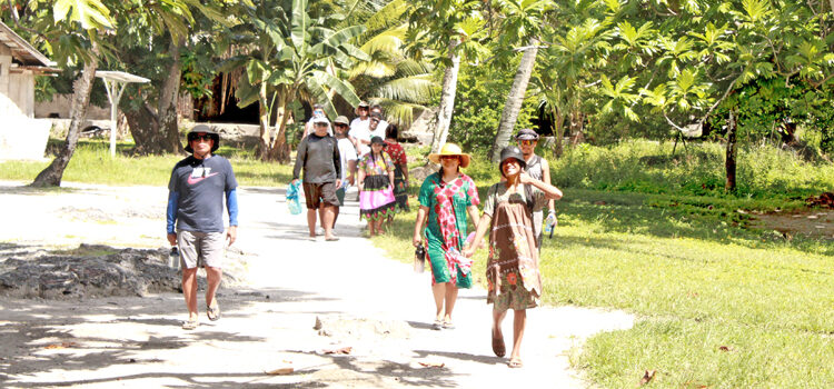 The Upward Bound group of students, teachers and administrators toured along Tarawa, Maloelap’s main road during a visit in August. Photo: Wilmer Joel. Postcard from Tarawa