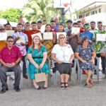 CMI President Dr. Irene Taafaki, center, joined with the National Training Council board and staff to recognize the 30 young people who completed the Boot Camp training program. Photo: Eve Burns.