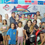 Kirt Pinho on his cool ride at the Marshalls Billfish Club dock area for the weigh-in at the All Micronesia Fishing Tournament surrounded by several generations of relatives and friends. Photo: MBC.