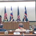 Foreign Minister Jack Ading, at the podium to the left, spoke during the Compact signing ceremony at the East-West Center in Honolulu October 16.