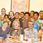 Dr. Irene Taafaki, center, joins USP staff and faculty at a 2014 farewell party for Tamara Greenstone, who is on Irene’s right, at the Marshall Islands Resort. At back left is her husband Falai Riva Taafaki.