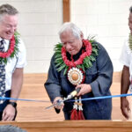 Elder Jeremy Jaggi and Kwajalein Stake President James Jelke look on as Iroojlaplap Michael Kabua cuts the ribbon to officially open the meeting house for Kwajalein Stake. Photo: Liahona Enos.