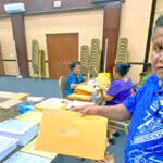 Chief Electoral Officer Ben Kiluwe with a postal ballot ready to be mailed. Photo: Hilary Hosia.