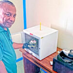 Ebeye EPA staff member Handel Dribo processes a water quality test at his office. Photo: Hilary Hosia.
