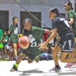 Marshall Islands High School player Lil'Yana Gideon drives to the basket against the Majuro Coop Mad Dogs defense during the high school championship game won by two points by Coop. Photo: Wilmer Joel.