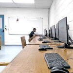 With CMI’s computer lab hard hit by power outages, students had to look elsewhere to do assignments or perform their research. Photo: Wilmer Joel.