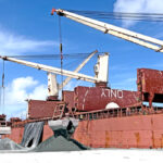 Freezer containers containing tuna, like these currently at Pacific International Inc.’s dock awaiting shipment to overseas canneries, are the focus of new studies. The studies say that investment in onshore cold storage facilities and new equipment needed to efficiently offload tuna from purse seiners directly into containers could add hundreds of new jobs and millions of dollars a year to the local economy. Photo: Giff Johnson.