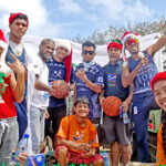 Athletes and coaches joined in with the National Olympic Committee float during the Chamber of Commerce Christmas parade. Photo: Wilmer Joel.