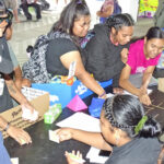 College of the Marshall Islands students engage in games and with the presentations put up by college and Upward Bound students. Photo: Wilmer Joel.