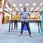 Sisters of Likiep candidates Tommy Kijiner, Jr. and Wallace Peter — Theresia Kijiner, left, and Tilta Peter — check their lots under the watchful eyes of Chief Electoral Officer Ben Kiluwe (at back) and Electoral official Bertnie Philippo at the ICC tabulation headquarters December 20. Photo: Hilary Hosia.