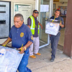 Police officers move postal ballot boxes from the Uliga post office to the ICC tabulation headquarters Monday December 4. Photo: Hilary Hosia.