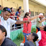 Marshall Islands High School students competed in a donut eating contest that had the audience laughing and cheering. Photo: Wilmer Joel.