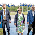 Minister in Assistance Bremity Lakjohn, right, and his wife Kenye Mike, were greeted by a Nauru official on arrival in Nauru last week. Photo: Chewy Lin.