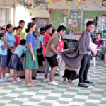Wilmer Joel, front right with cape, rehearses with the cast of Oliver! at the MIHS library. The play will open at the International Conference Center Monday March 4.
